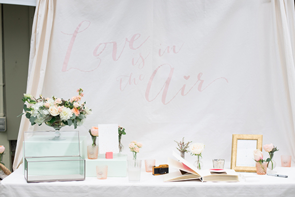 wedding bouquet added to guest book table