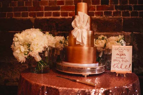 wedding bouquets added to wedding cake table