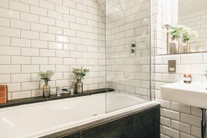Industrial Living loft apartment bathroom subway tiles slate copper