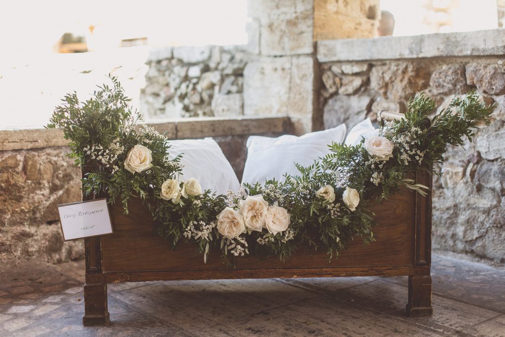 Flower girls cot wedding cermony ideas floral garland by Passion for Flowers destination wedding Tuscany