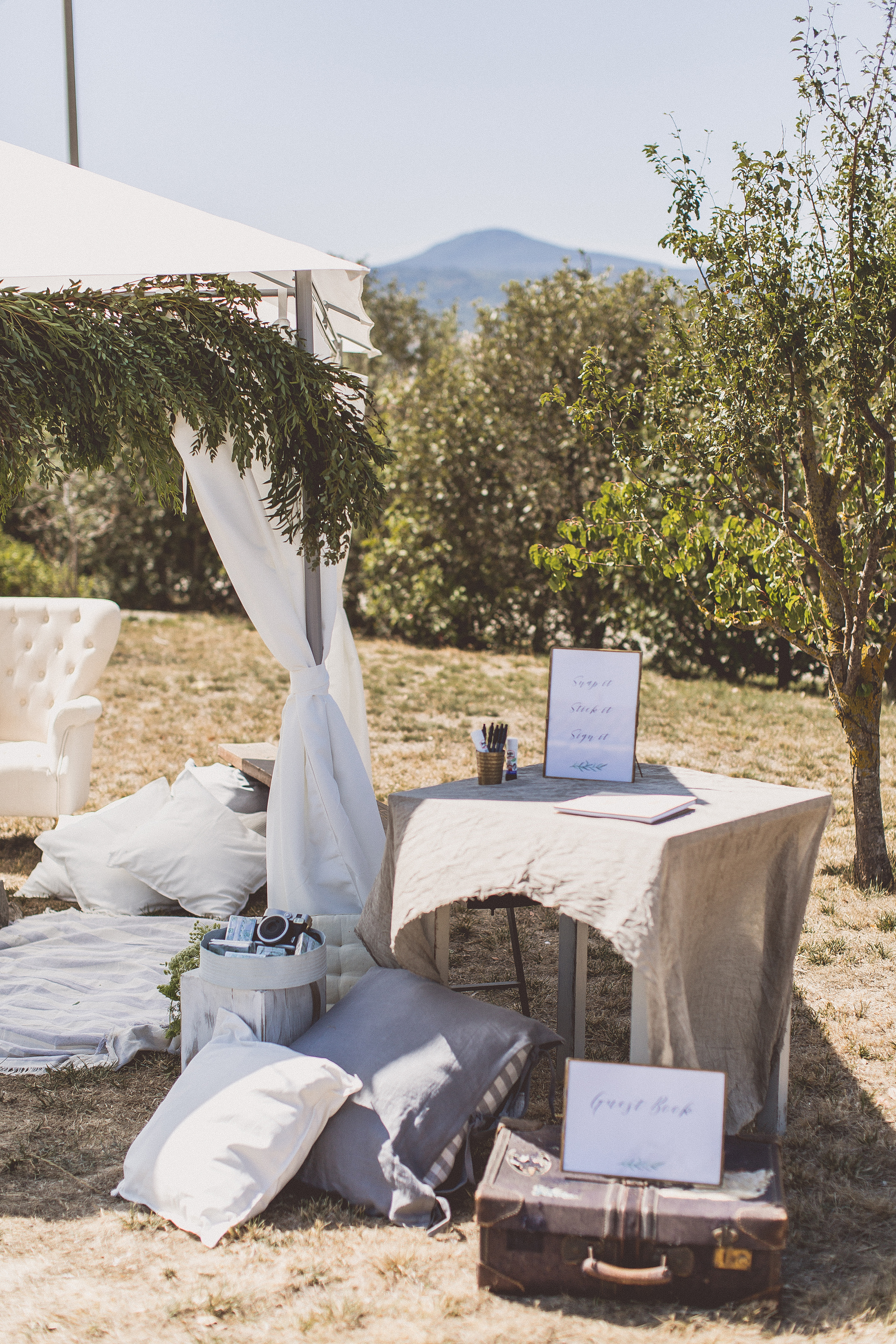 Polaroid camera guest book area outdoor wedding