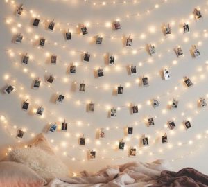 Wedding photo displays LED lights pegs and polaroid cameras
