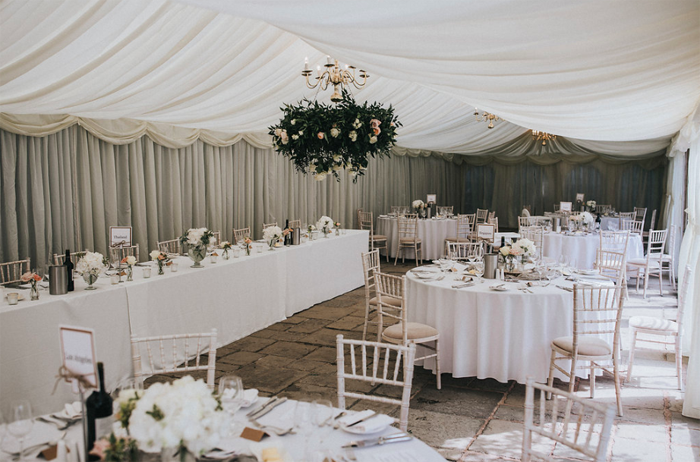 Hanging flower hoops in marquee wedding venues Birtsmorton Court