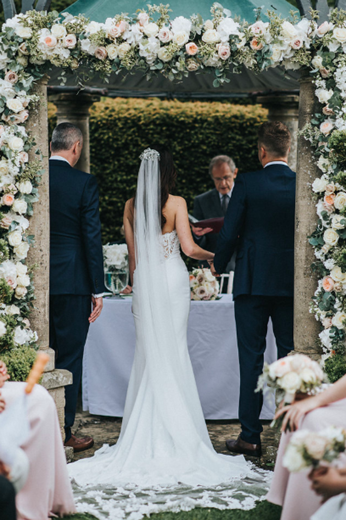 Rose arch intimate outdoor wedding ceremony Passion for Flowers