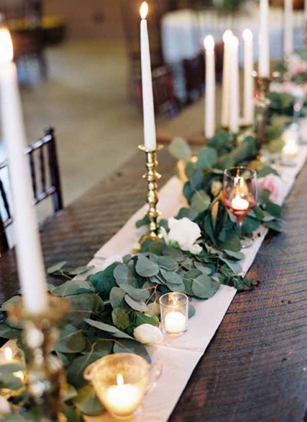 barn wedding foliage garlands with gold candlesticks