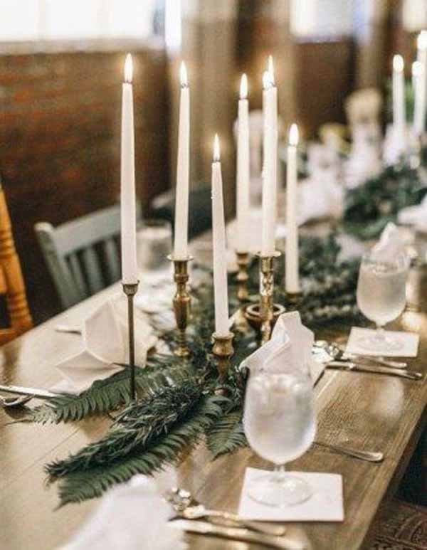 barn wedding gold candlestcks foliage garlands along tables