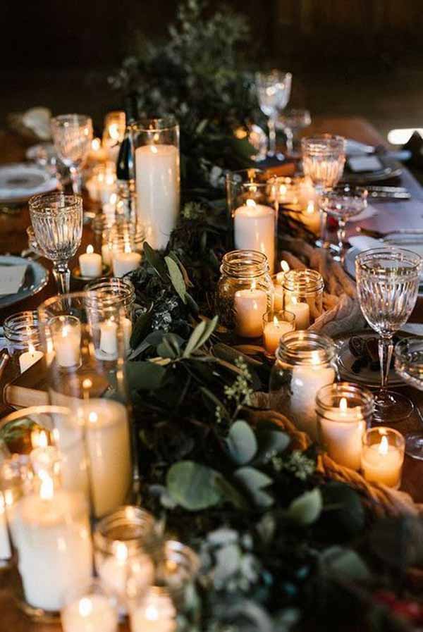 barn wedding with foliage garlands and lanterns