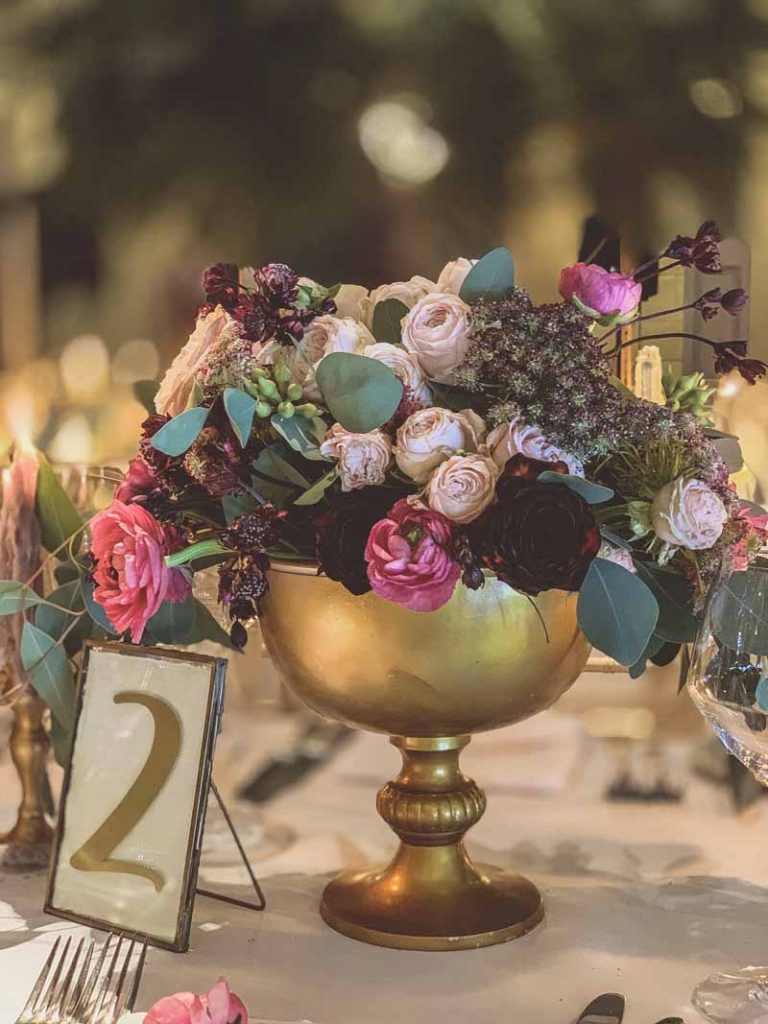 gold table number in brass frame