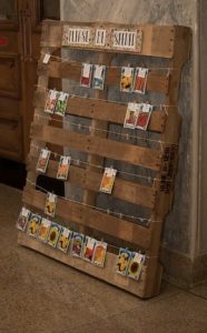 peg photos onto a wooden pallet wedding ideas