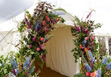 marquee arch entrance of wild flowers