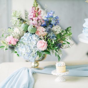 summer barn wedding blue cake table with gold footed bowl wedding flowers centrepieces 2