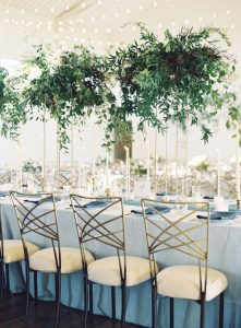 tall gold floral stands foliage green wedding