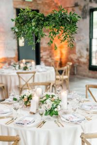 hanging hoops suspended over wedding table centrepieces