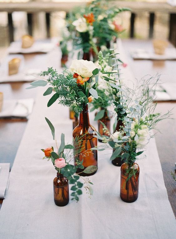 brown amber bottles wedding centrepieces