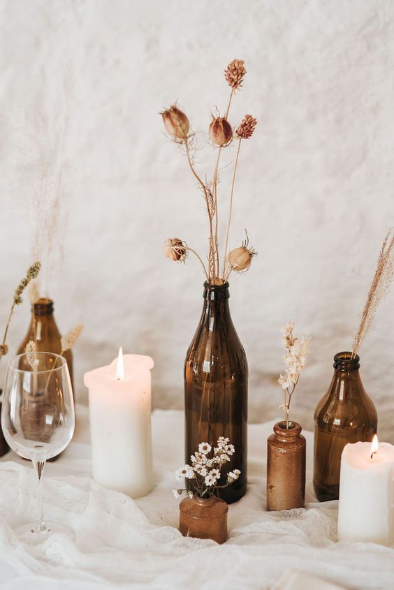 brown amber bottles wedding centrepieces