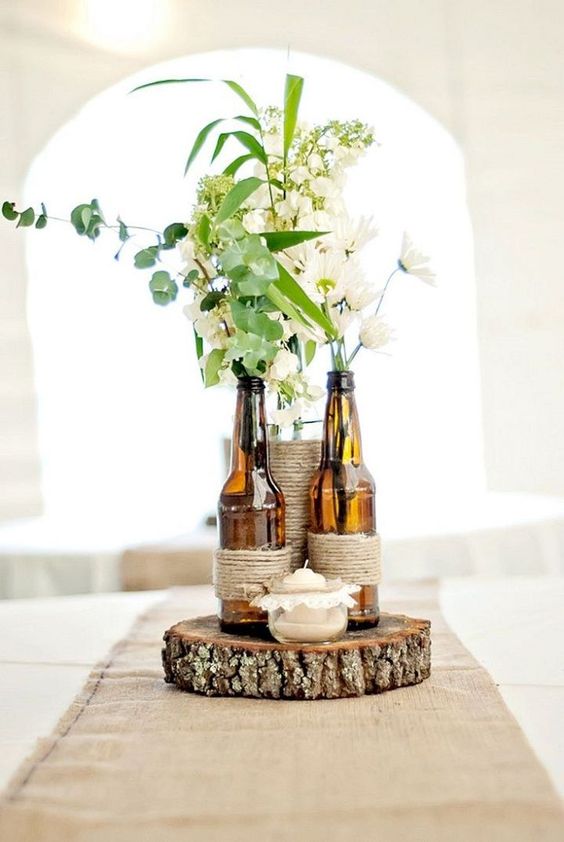 brown amber bottles wedding centrepieces