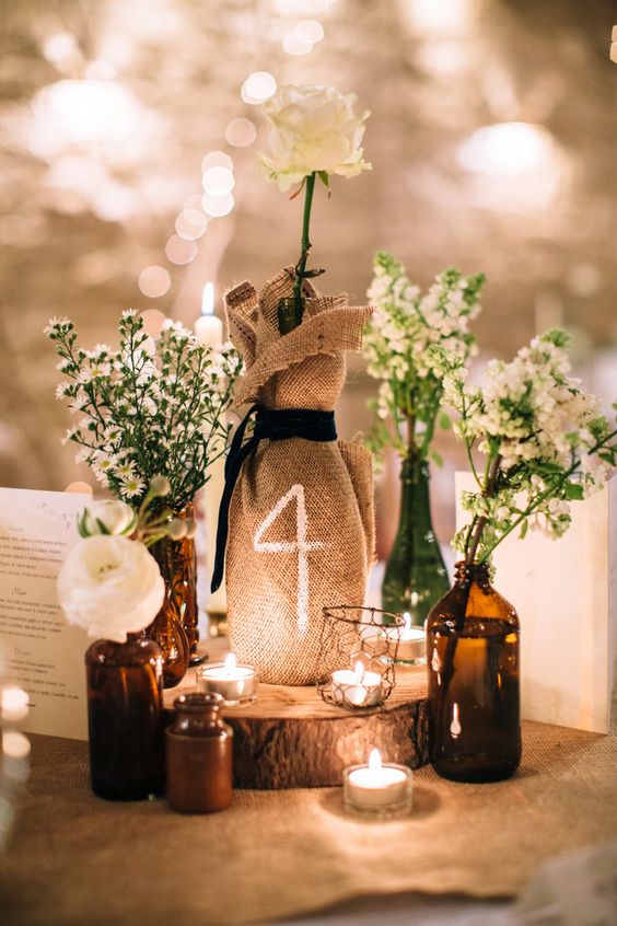 brown amber bottles wedding centrepieces