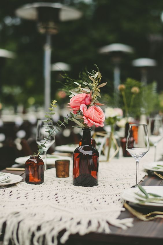 brown amber bottles wedding centrepieces