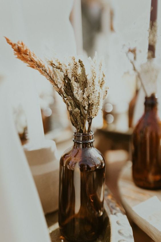 brown amber bottles wedding centrepieces