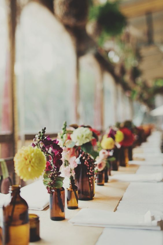 brown amber bottles wedding centrepieces