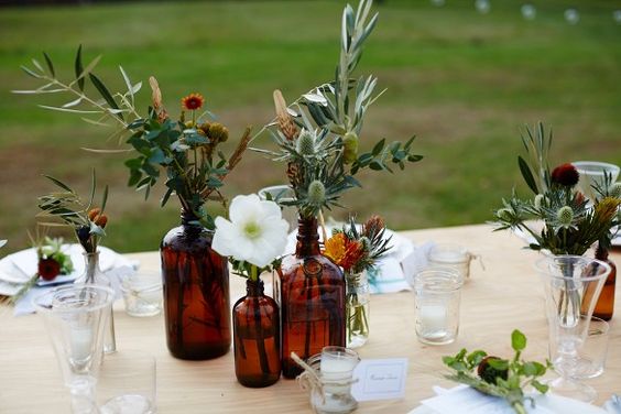 brown amber bottles wedding centrepieces