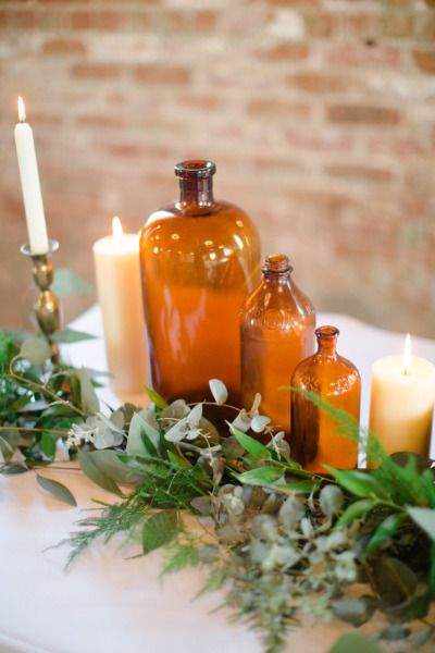 brown amber bottles wedding centrepieces