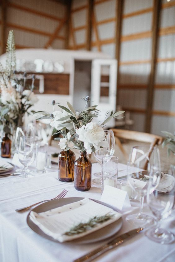 brown amber bottles wedding centrepieces