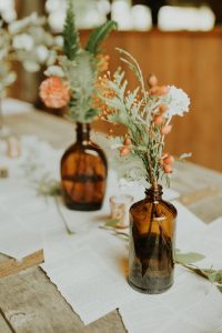 brown amber bottles wedding centrepieces