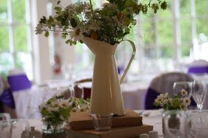 distressed cream jug wedding centre piece
