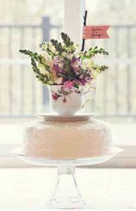 flowers in a tea cup wedding cake topper