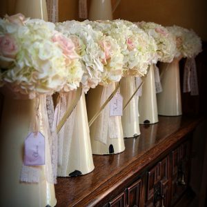 display bouquets in cream jugs for bridesmaids