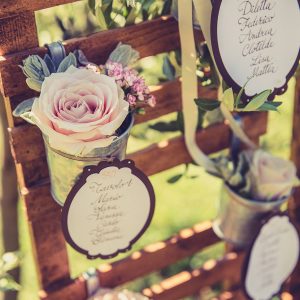 rustic wooden table plan with flower pots available from The Wedding of my Dreams