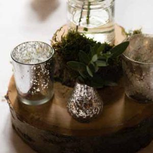 woodland wedding centrepiece tree slice mercury silver vases candle holders