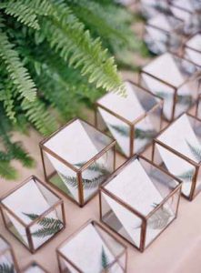 elegant wedding escort cards in gold and glass boxes for each guest