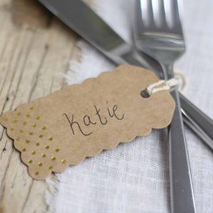 Brown kraft luggage tags with gold polka dots available from @theweddingomd