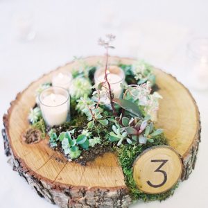 moss wedding centrepieces rustic tree slice