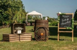 Rustic wedding styling with old cart wheels wagon wheels