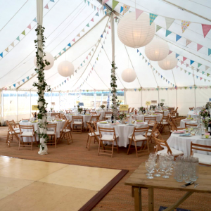 Marquee wedding foliage around poles hanging paper lanterns Space Intense 4