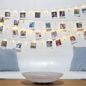 wedding ideas peg up photos around your venue