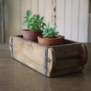brick mould with potted plants wedding centrepiece