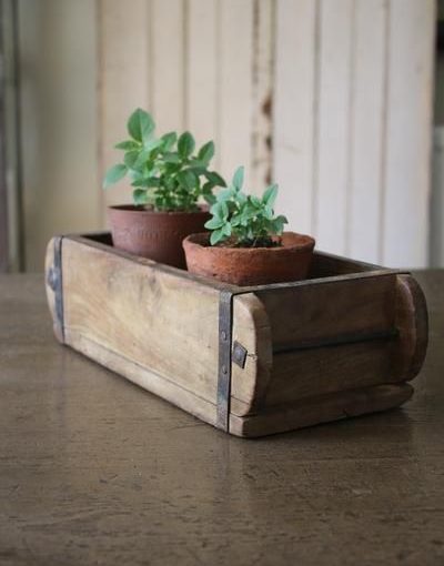 brick mould with potted plants wedding centrepiece