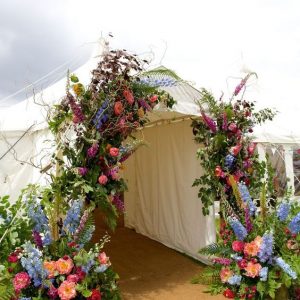 marquee arch entrance of wild flowers