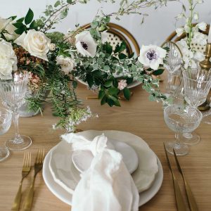 soft romantic wedding place settings napkin knotted on plate
