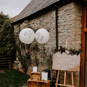 welcome wedding sign with balloons